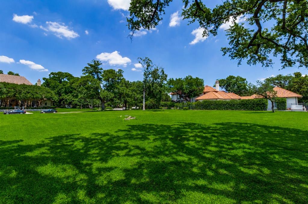 4311 Rheims Place Highland Park, TX 75205 - Photo 4 of 9 Expansive green lawn with mature trees and natural shade