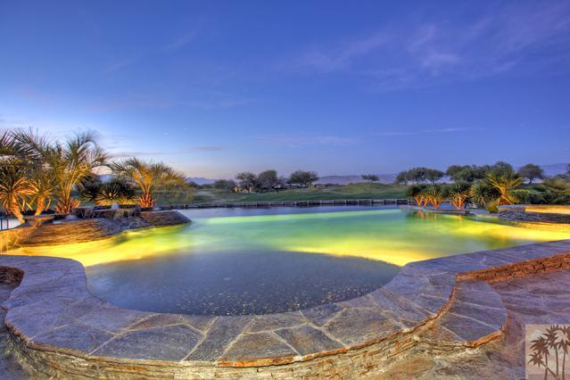 384 Loch Lomond Road Rancho Mirage, CA 92270 - Photo 1 of 25 a view of a swimming pool with an outdoor space and seating area