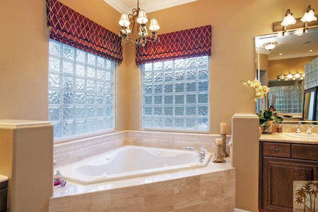 384 Loch Lomond Road Rancho Mirage, CA 92270 - Photo 15 of 25 a bath tub sitting next to a bathroom sink