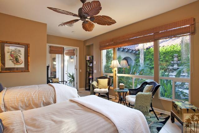 384 Loch Lomond Road Rancho Mirage, CA 92270 - Photo 16 of 25 a bedroom with furniture and large windows