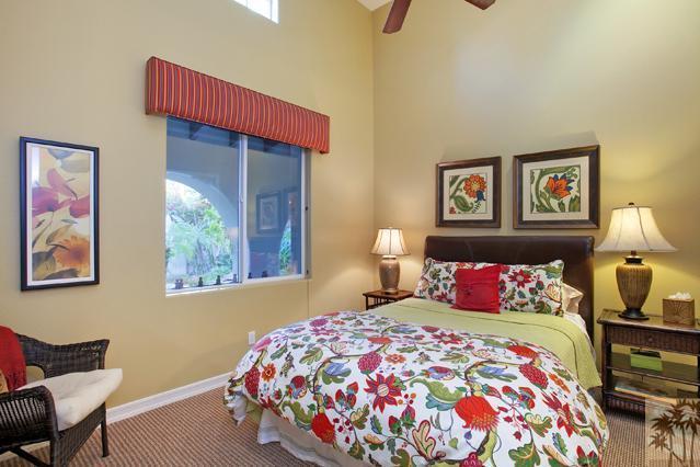384 Loch Lomond Road Rancho Mirage, CA 92270 - Photo 17 of 25 a bedroom with a bed and a lamp on dresser