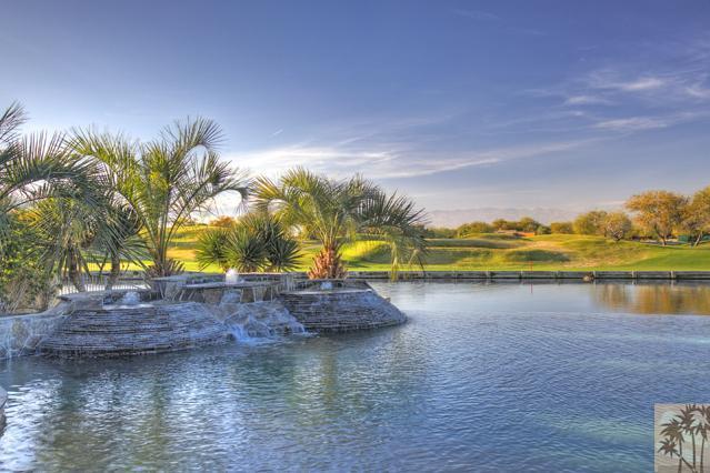 384 Loch Lomond Road Rancho Mirage, CA 92270 - Photo 18 of 25 a view of a lake with a house in the background