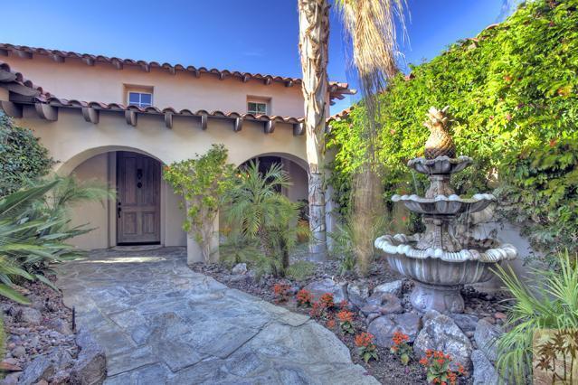 384 Loch Lomond Road Rancho Mirage, CA 92270 - Photo 3 of 25 a front view of a house with garden