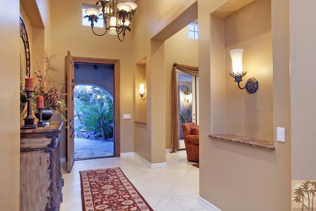 384 Loch Lomond Road Rancho Mirage, CA 92270 - Photo 5 of 25 a view of a hallway with chandelier and glass door