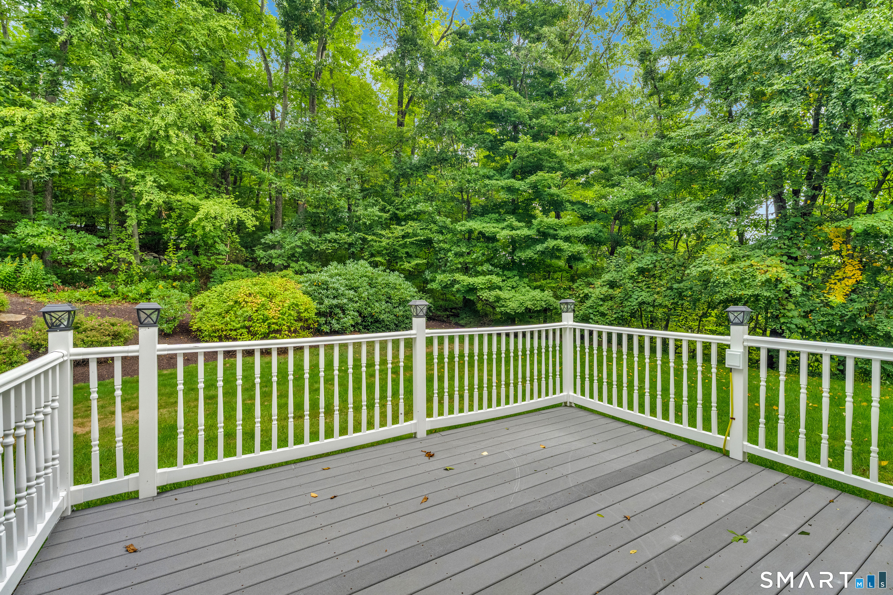 24 Judd Hill Road Bethany, CT 06524 - Photo 19 of 23 The deck off the kitchen invites you into the backyard.