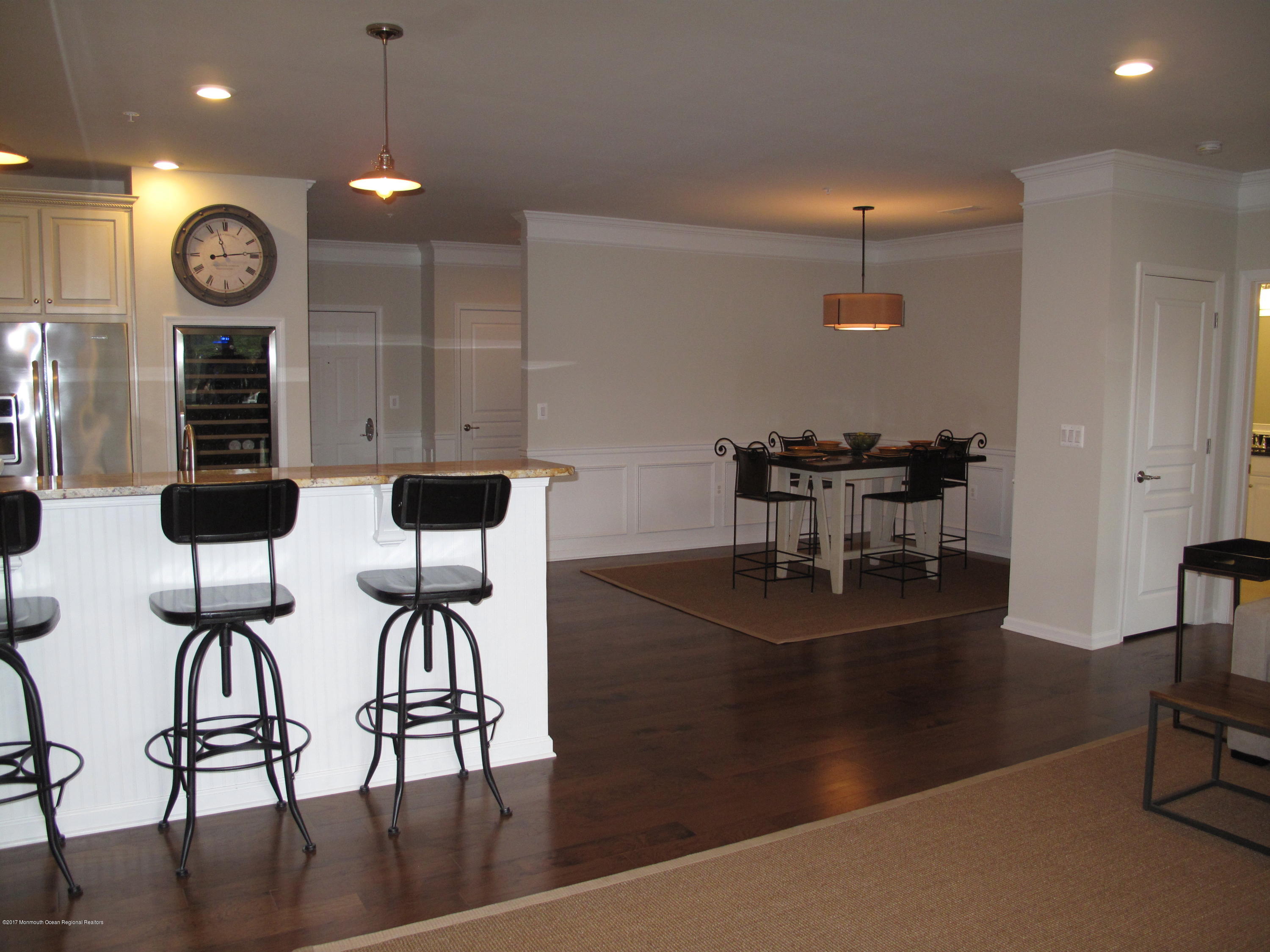 2201 River Road, Unit 4304 Point Pleasant, NJ 08742 - Photo 11 of 30 a view of a dining room with furniture and wooden floor