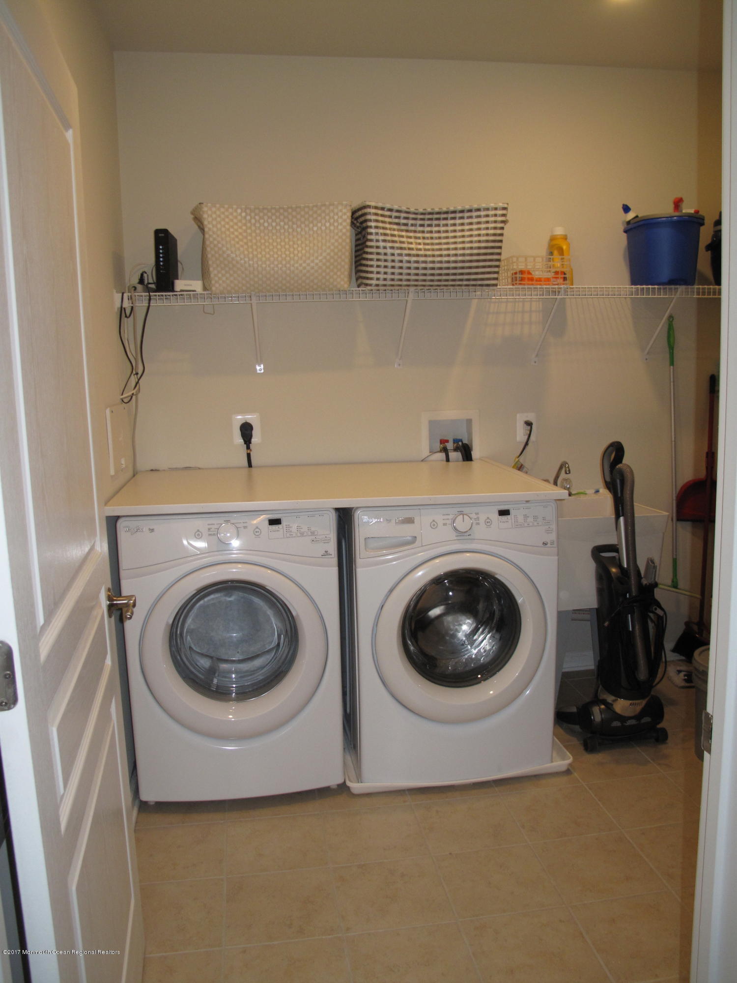 2201 River Road, Unit 4304 Point Pleasant, NJ 08742 - Photo 18 of 30 a utility room with sink dryer and washer