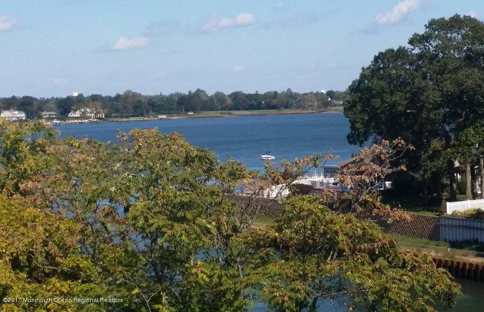 2201 River Road, Unit 4304 Point Pleasant, NJ 08742 - Photo 26 of 30 a view of a lake with houses in the back