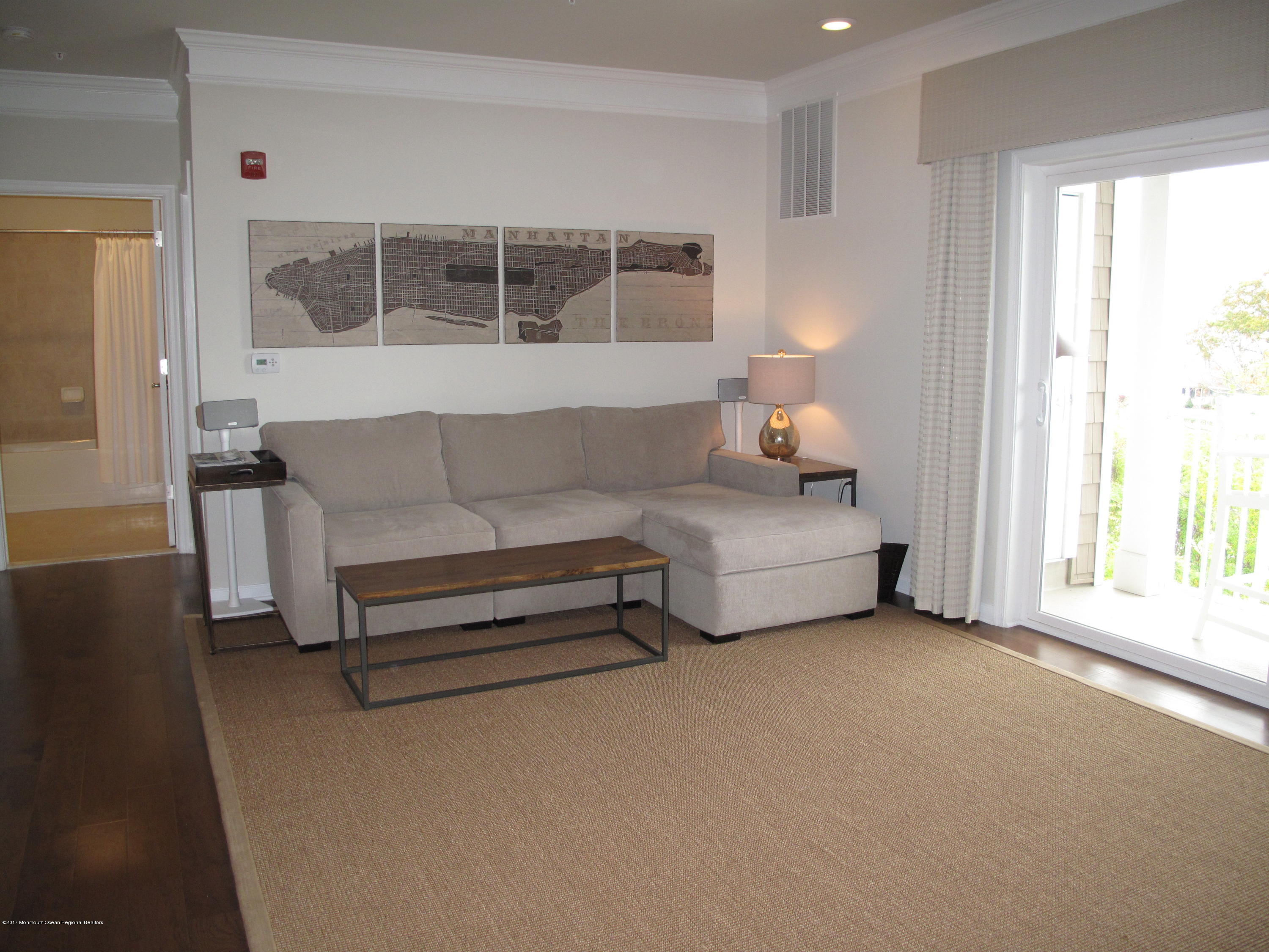 2201 River Road, Unit 4304 Point Pleasant, NJ 08742 - Photo 9 of 30 a living room with furniture and a window