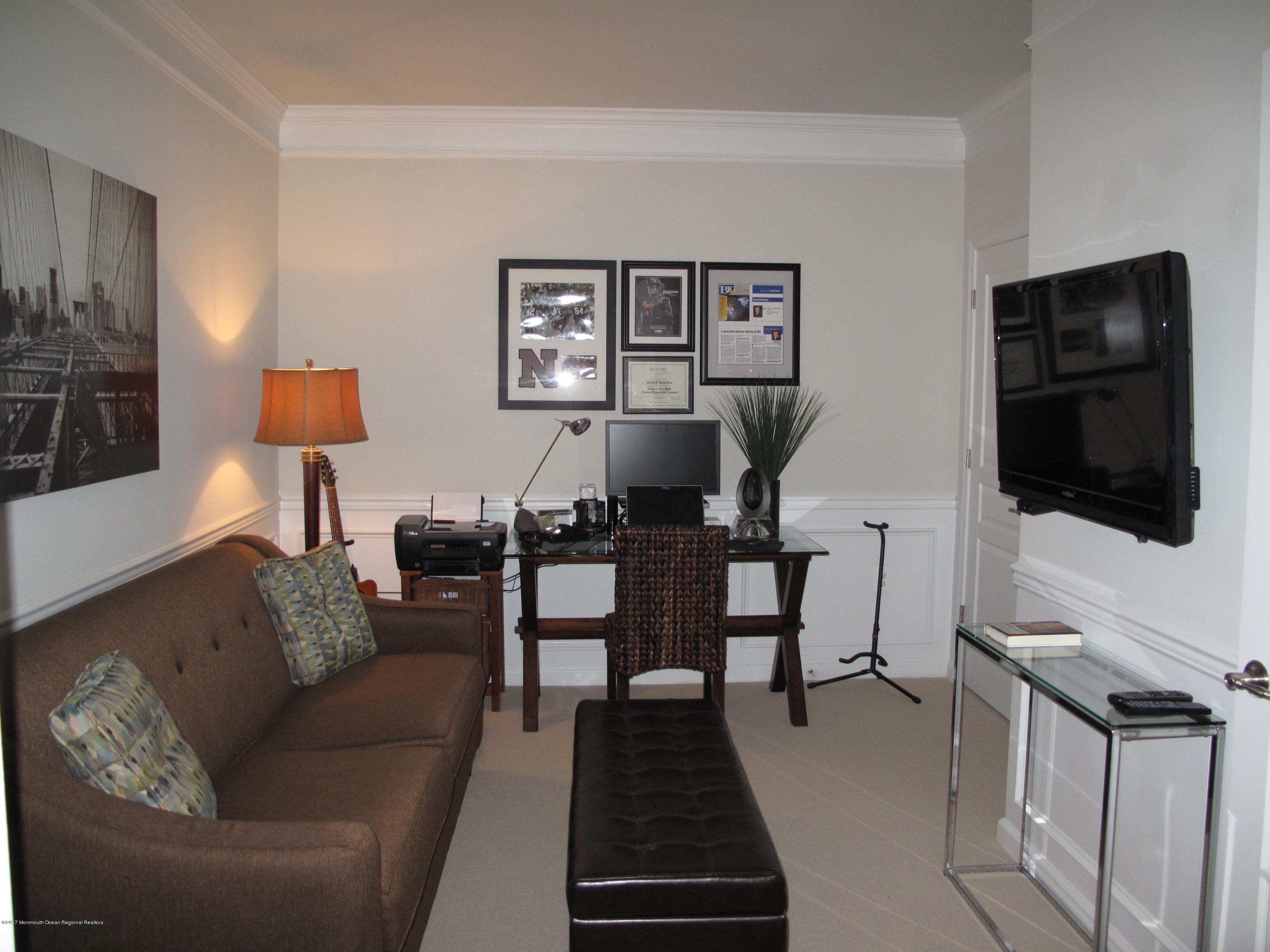 2201 River Road, Unit 4304 Point Pleasant, NJ 08742 - Photo 10 of 30 a living room with furniture a flat screen tv and kitchen view