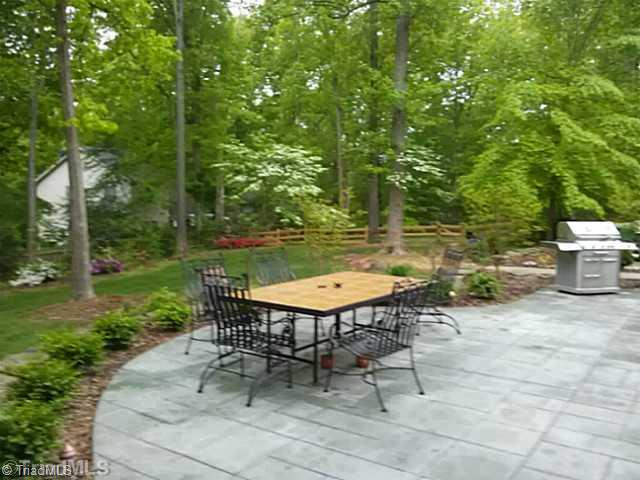 930 Williams Road Lewisville, NC 27023 - Photo 15 of 15 Exterior Back. Stamped concrete patio