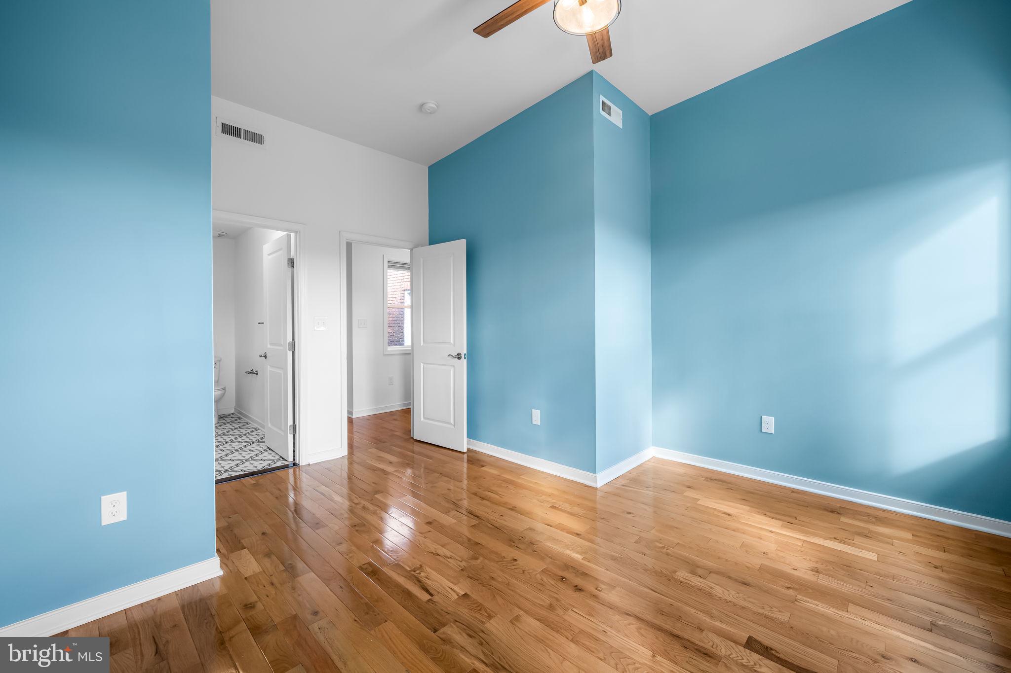 3716 Gough Street Baltimore, MD 21224 - Photo 16 of 33 a view of an empty room with wooden floor