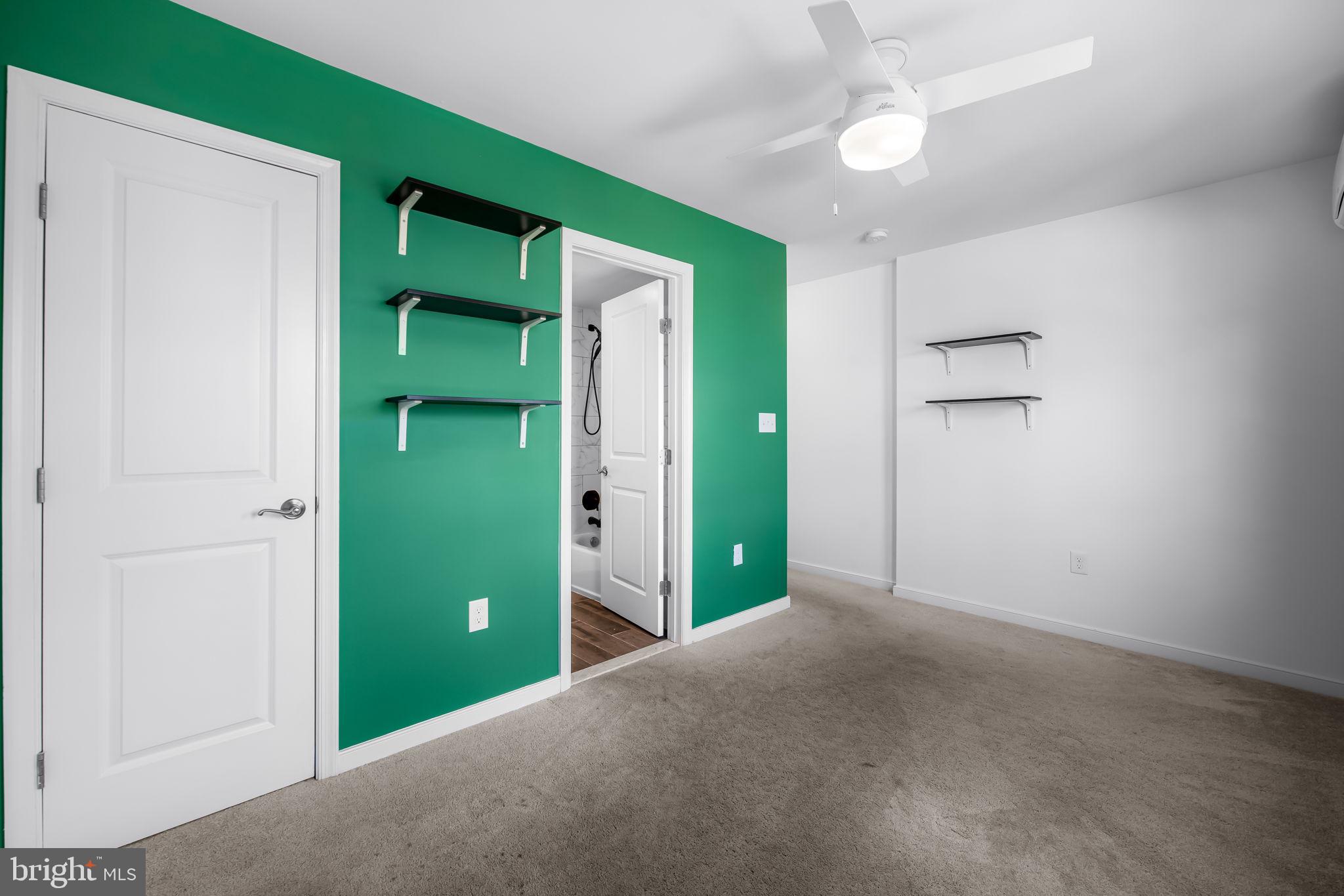 3716 Gough Street Baltimore, MD 21224 - Photo 21 of 33 an empty room with closet and a window