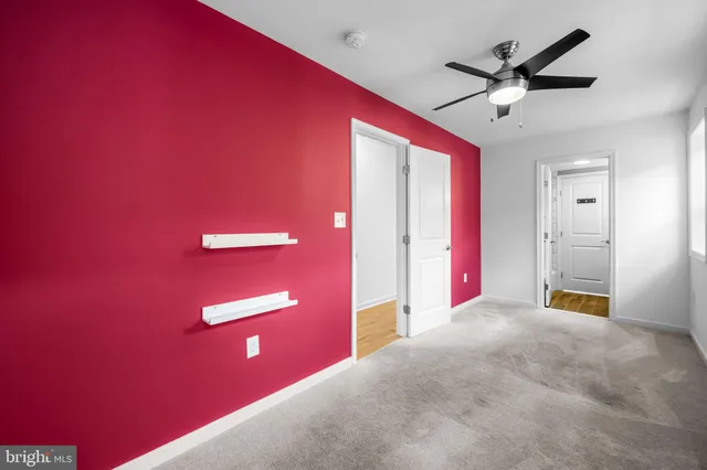 a view of a livingroom with a red carpet