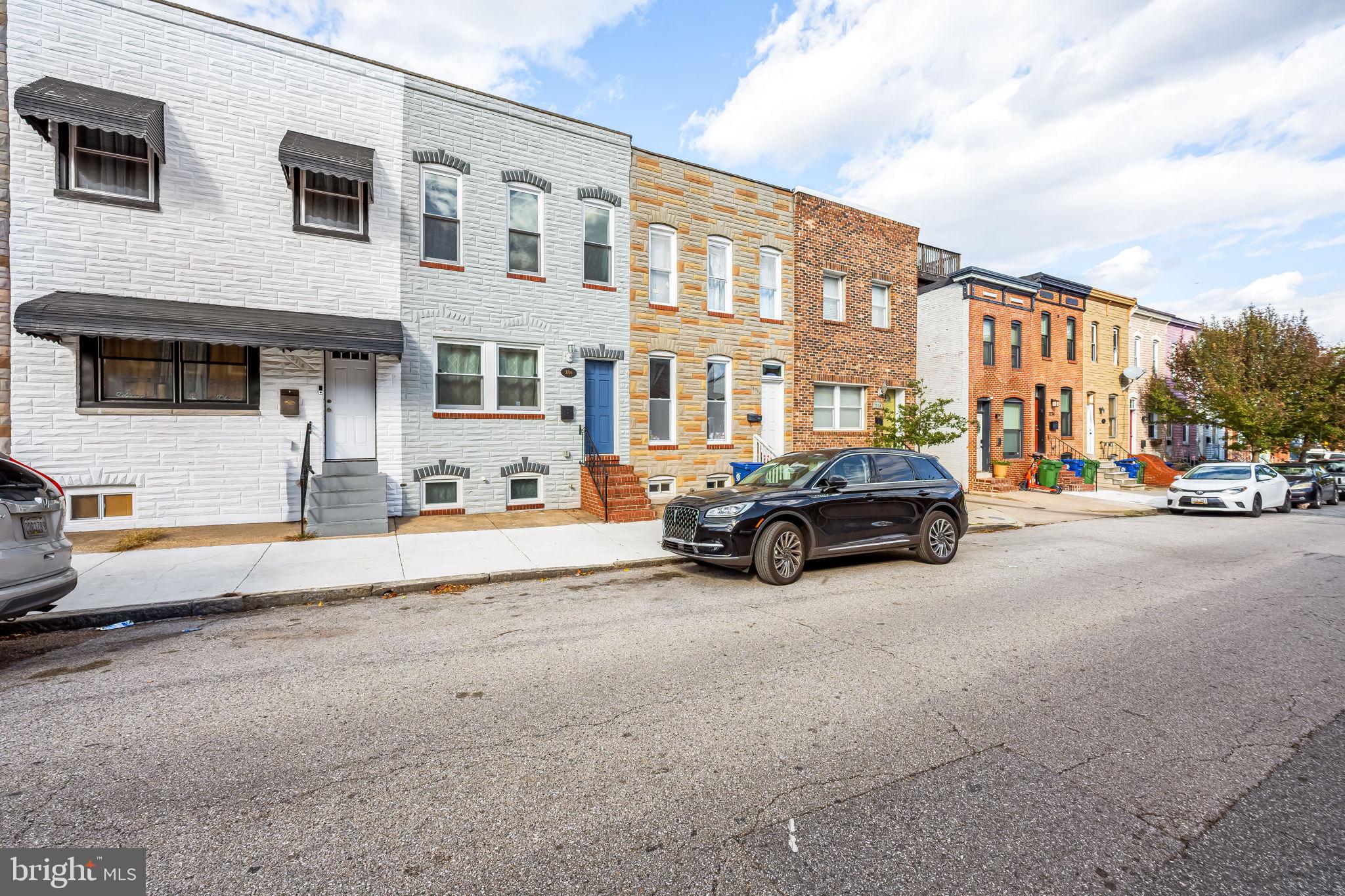 3716 Gough Street Baltimore, MD 21224 - Photo 5 of 33 a car parked in front of a building