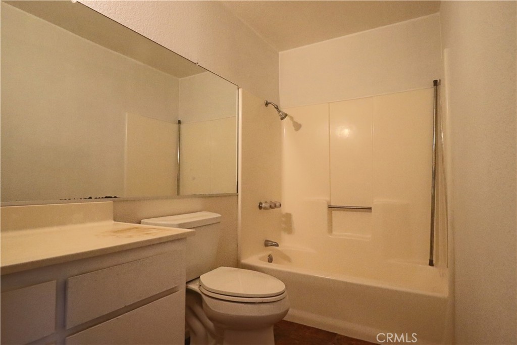 4752 Flying H Road Twentynine Palms, CA 92277 - Photo 43 of 55 a bathroom with a sink a toilet and shower