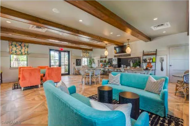 a living room with furniture and a large window