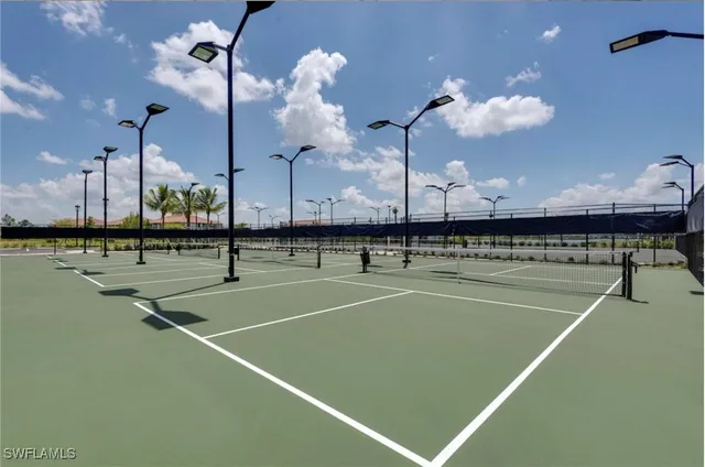 a indoor swimming pool with lots of furniture and a chandelier