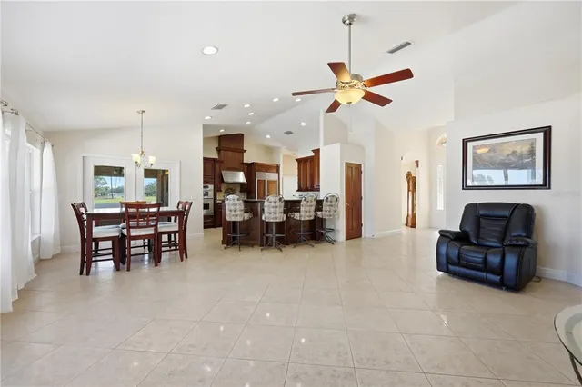 a view of a livingroom with furniture and a ceiling fan