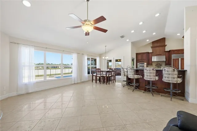 a view of a dining room with furniture window and outside view