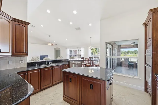a kitchen with lots of counter top space and sink