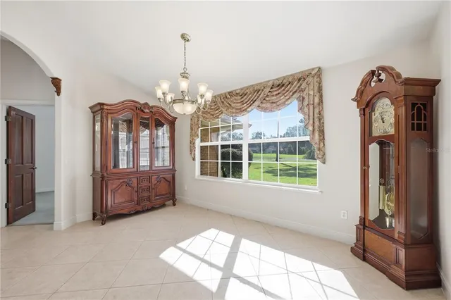 a view of living room with furniture and a chandelier