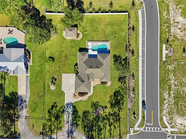 an aerial view of a residential apartment building with a yard
