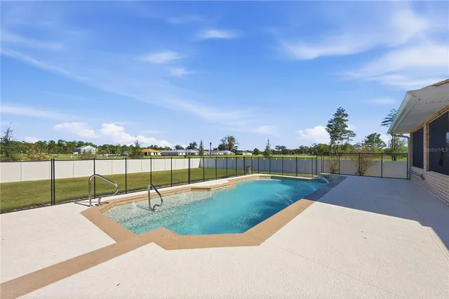 a view of a garden and swimming pool