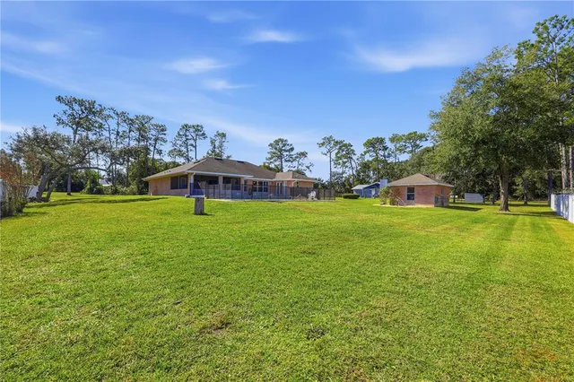 a view of a house with a big yard