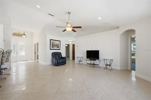 a view of a livingroom with furniture and a flat screen tv