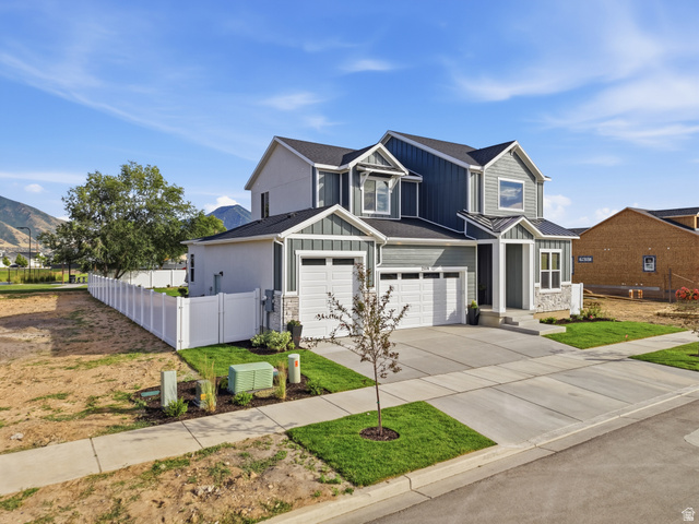 2559 West Aurora Avenue Mapleton, UT 84664 - Photo 2 of 60 Contemporary two-story residence featuring a multi-textured facade with horizontal siding, vertical board and batten, and stone accents