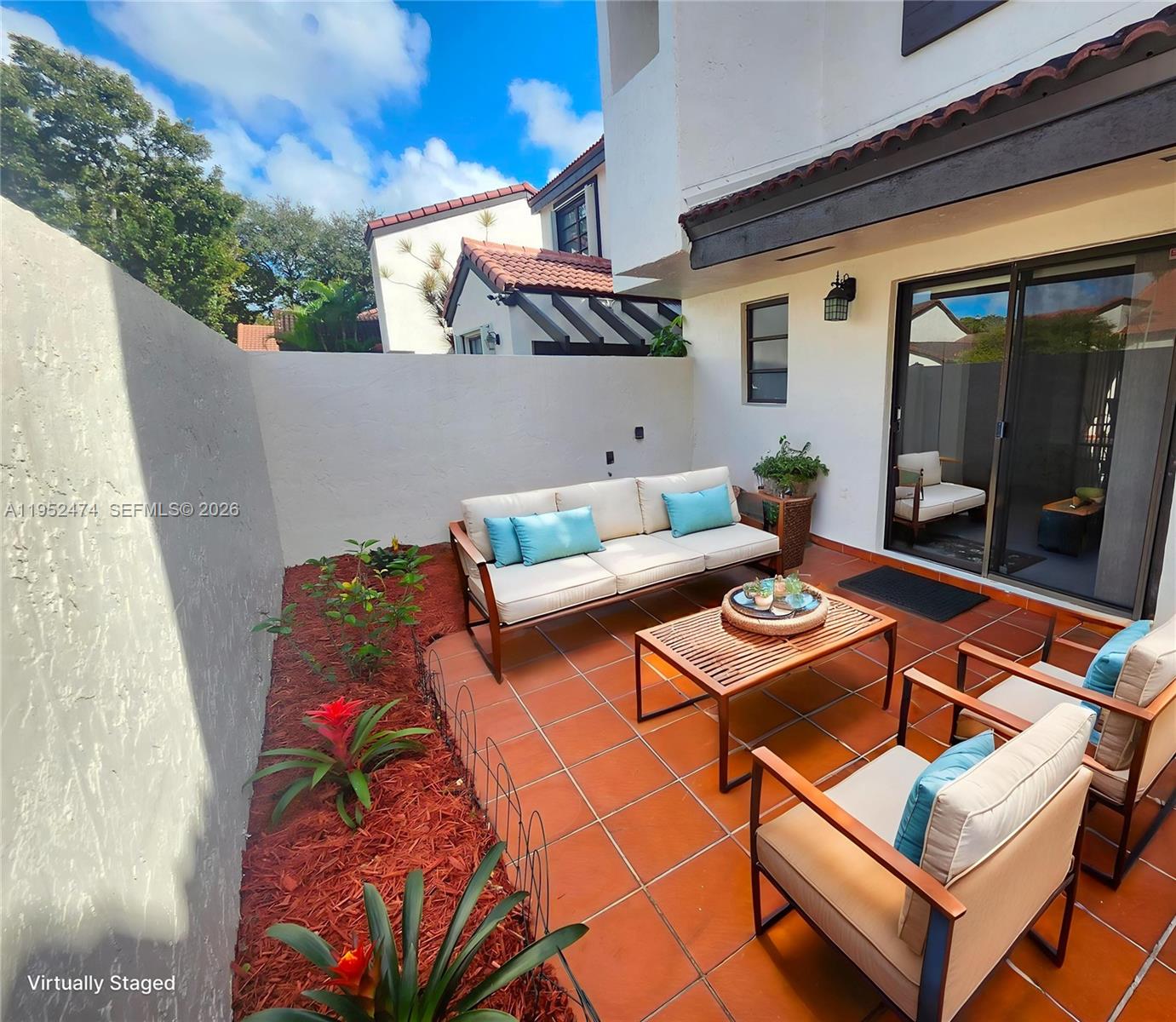 12396 Southwest 94th Lane, Unit 12396 Miami, FL 33186 - Photo 14 of 32 a outdoor space with patio couches and a potted plant