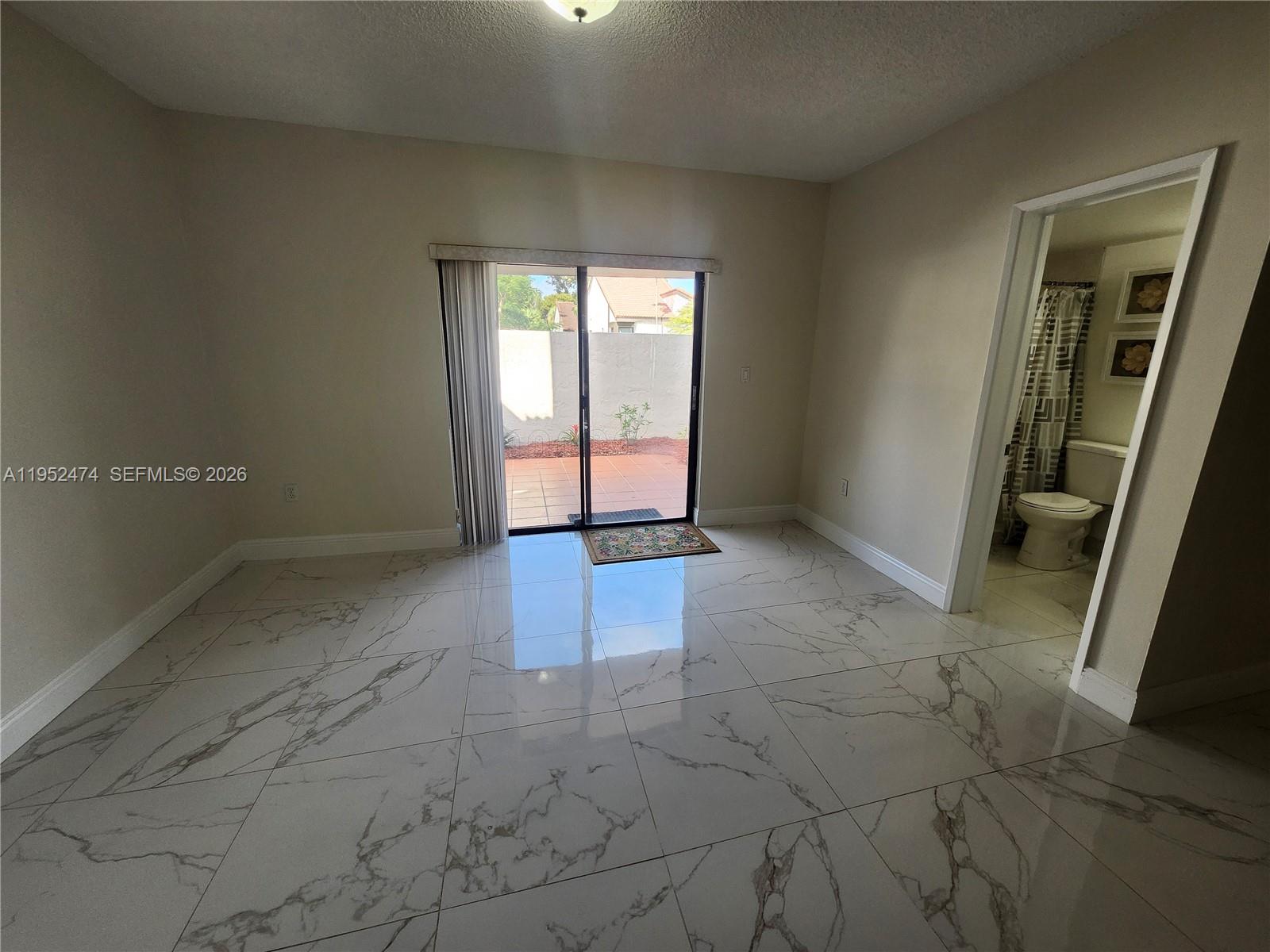 12396 Southwest 94th Lane, Unit 12396 Miami, FL 33186 - Photo 16 of 32 an empty room with windows