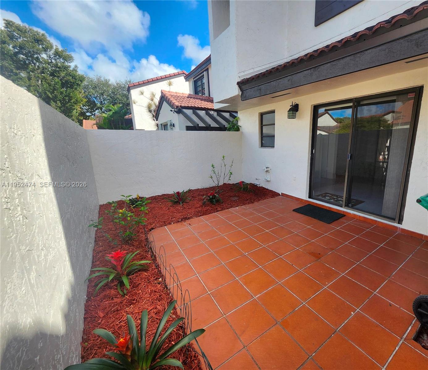 12396 Southwest 94th Lane, Unit 12396 Miami, FL 33186 - Photo 17 of 32 a front view of a house with a garage