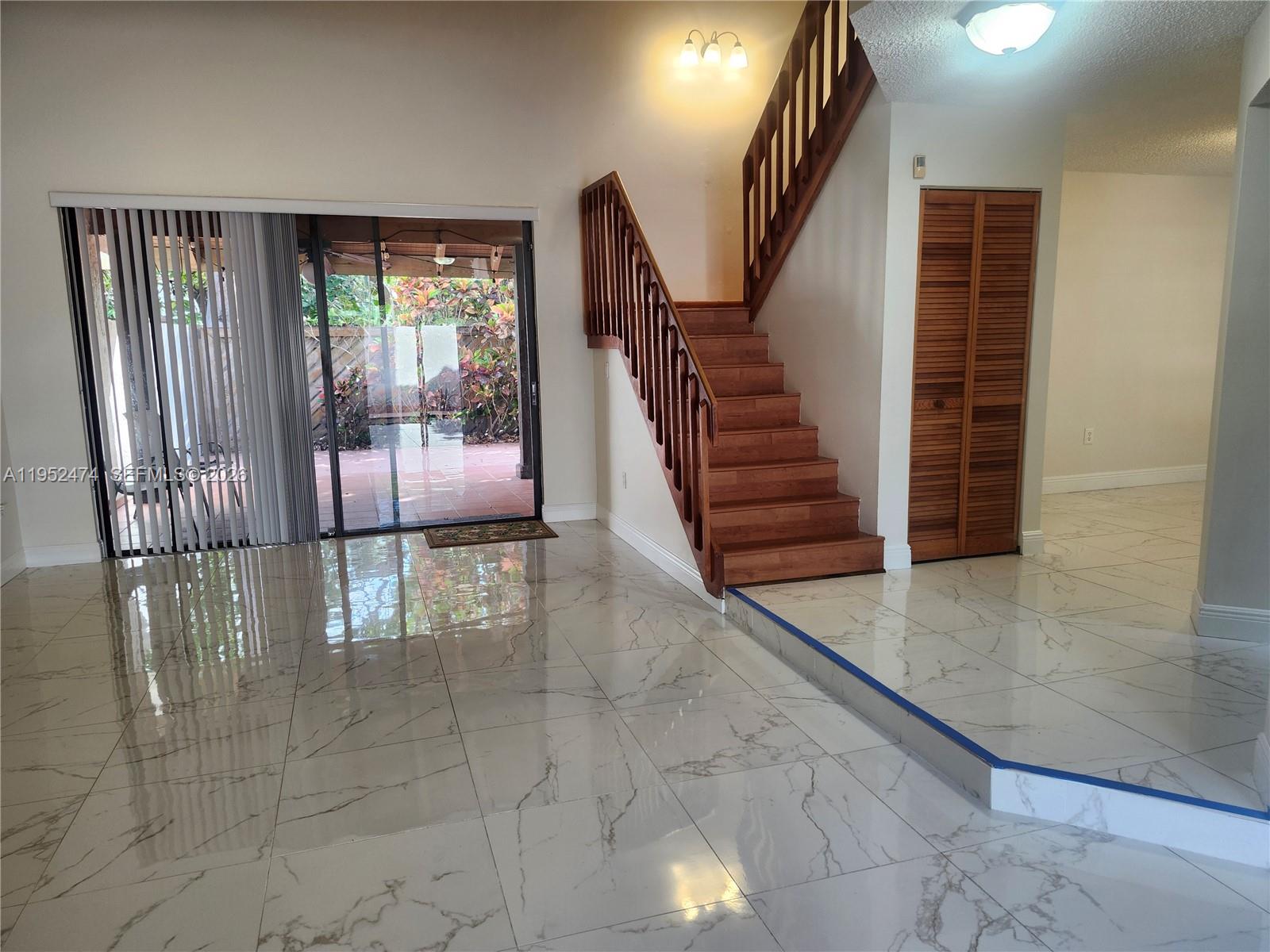12396 Southwest 94th Lane, Unit 12396 Miami, FL 33186 - Photo 19 of 32 a view of entryway and hall with wooden floor
