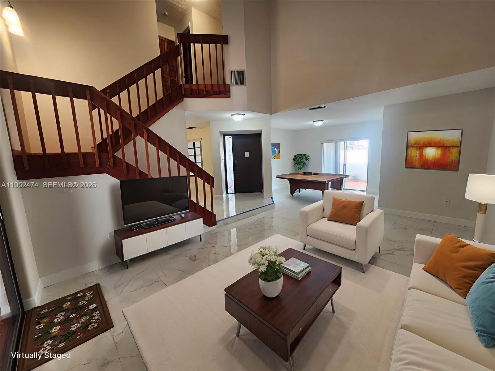 12396 Southwest 94th Lane, Unit 12396 Miami, FL 33186 - Photo 2 of 32 a living room with furniture