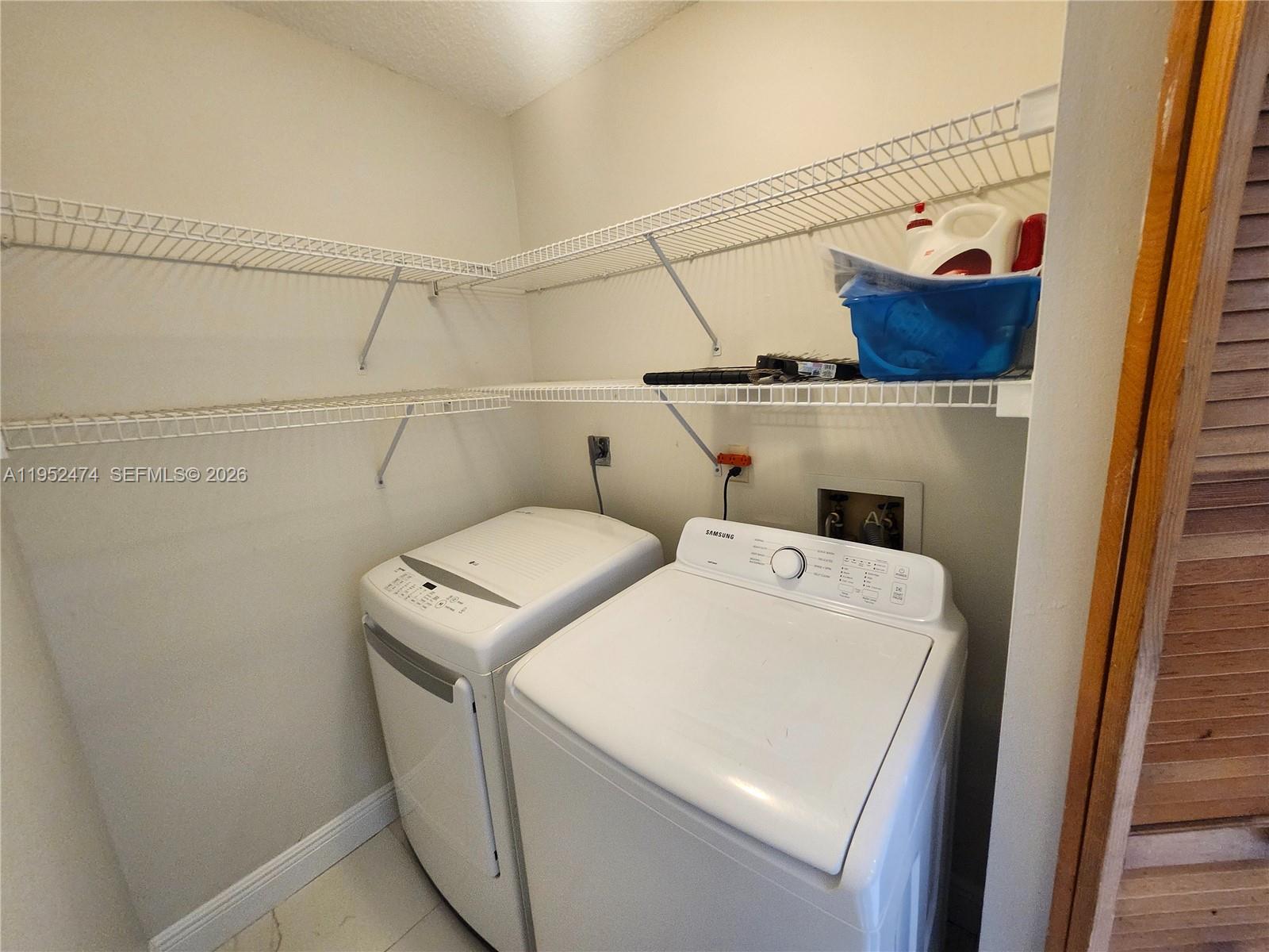 12396 Southwest 94th Lane, Unit 12396 Miami, FL 33186 - Photo 22 of 32 a utility room with dryer and washer