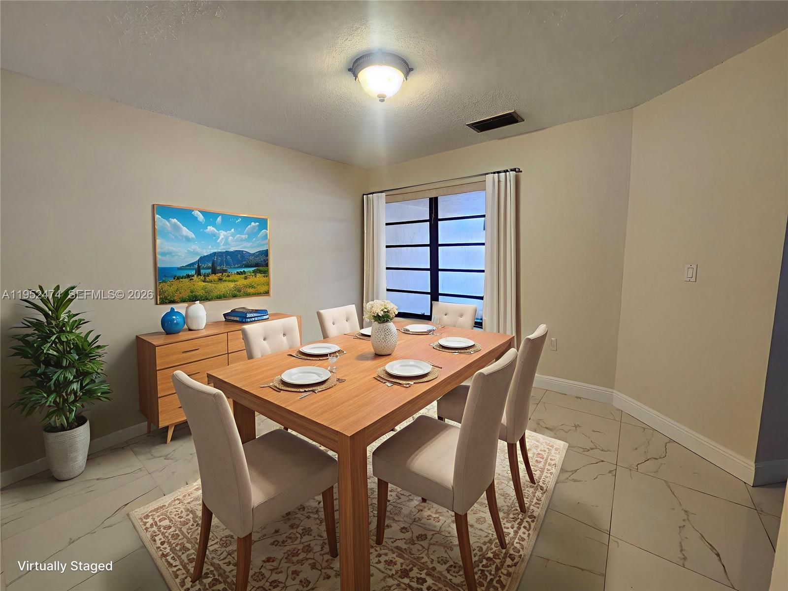 12396 Southwest 94th Lane, Unit 12396 Miami, FL 33186 - Photo 5 of 32 a view of a dining room with furniture and window