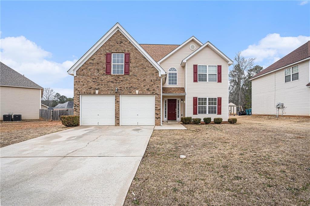 290 Millstone Drive Hampton, GA 30228 - Photo 1 of 1 a front view of a house with a yard