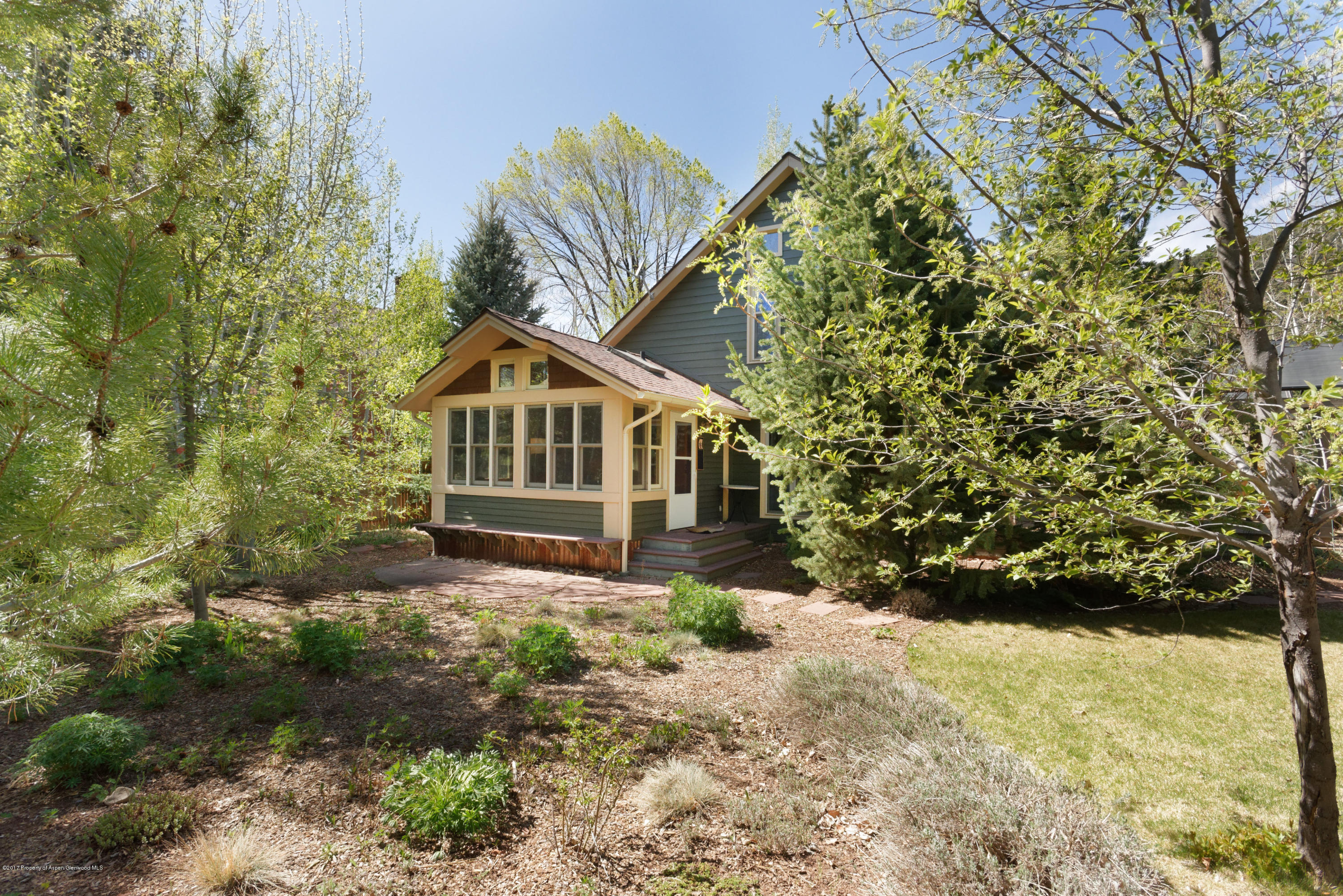 295 Riverside Drive Basalt, CO 81621 - Photo 21 of 27 a house with trees in front of it