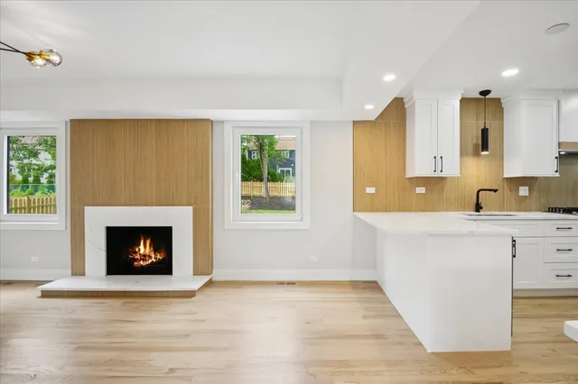 a living room with granite countertop furniture and a fireplace