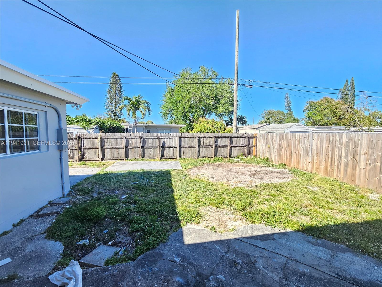 5621 Cleveland Street Hollywood, FL 33021 - Photo 16 of 19 a view of a backyard with a garden