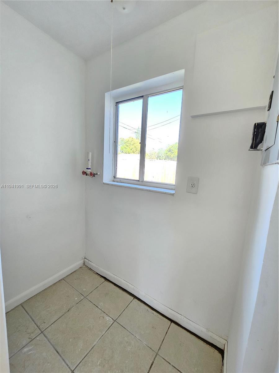 5621 Cleveland Street Hollywood, FL 33021 - Photo 18 of 19 an empty room with a window