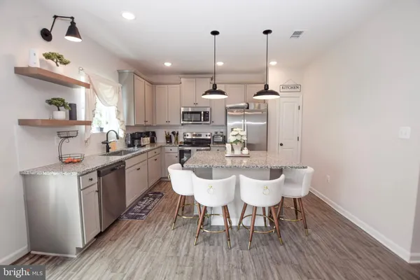 a room with furniture and wooden floor