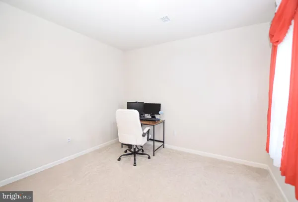 a kitchen with stainless steel appliances granite countertop a kitchen island a stove a table and chairs