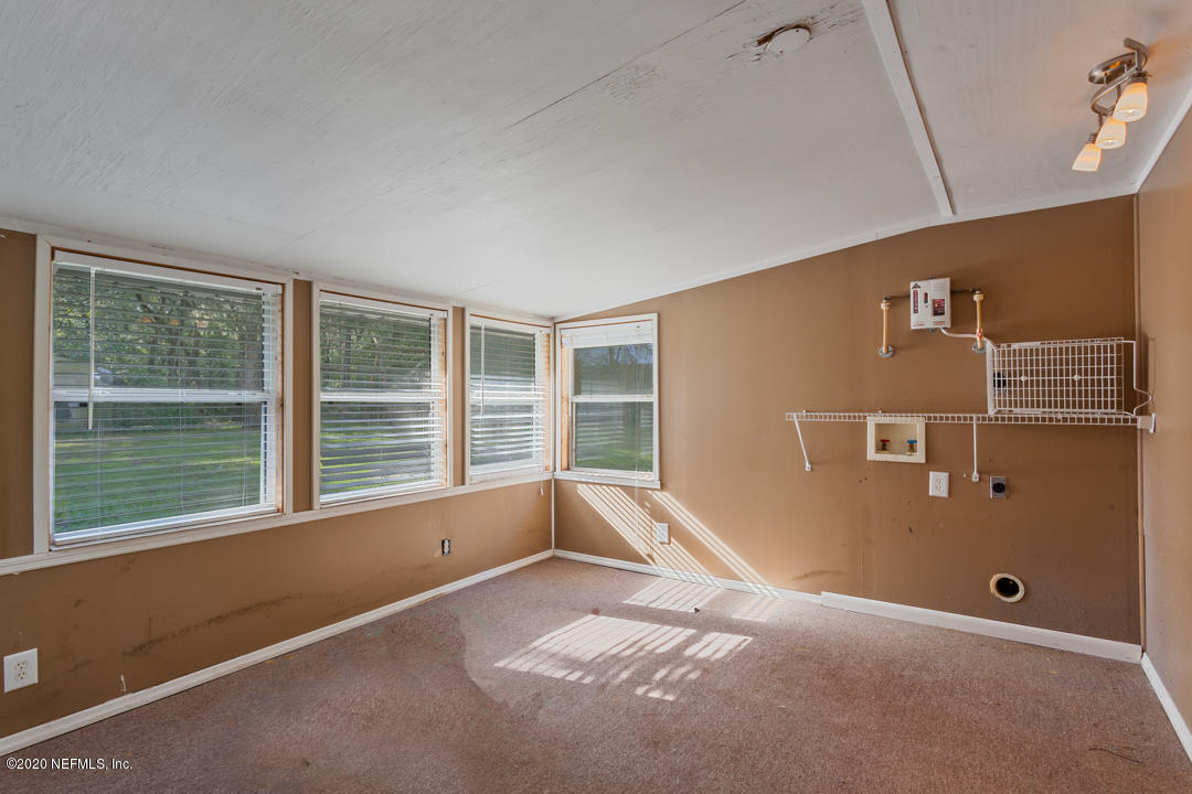 6576 Immokalee Road Keystone Heights, FL 32656 - Photo 11 of 31 a view of an empty room with a window