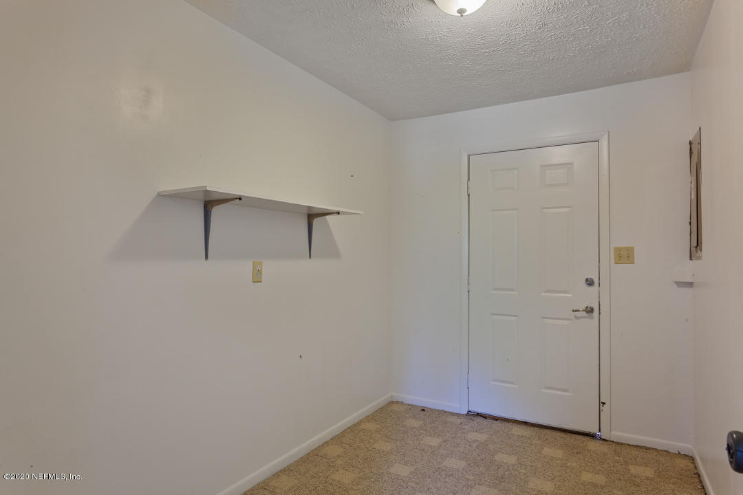6576 Immokalee Road Keystone Heights, FL 32656 - Photo 13 of 31 an empty room with closet area