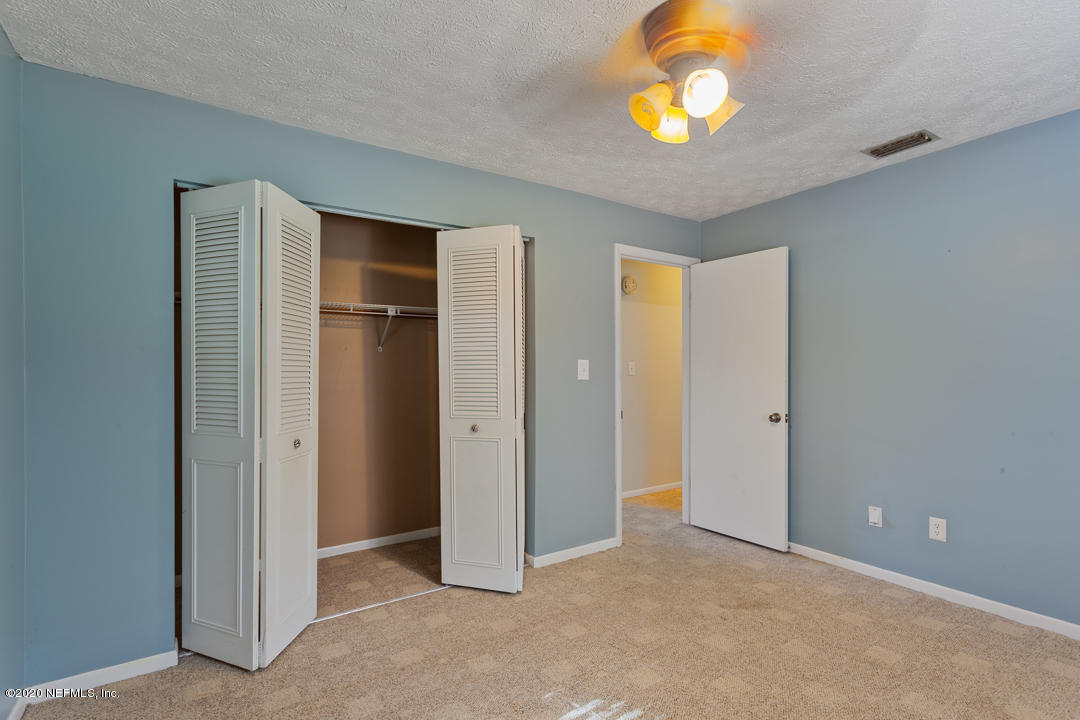 6576 Immokalee Road Keystone Heights, FL 32656 - Photo 19 of 31 a view of an empty room with window and closet