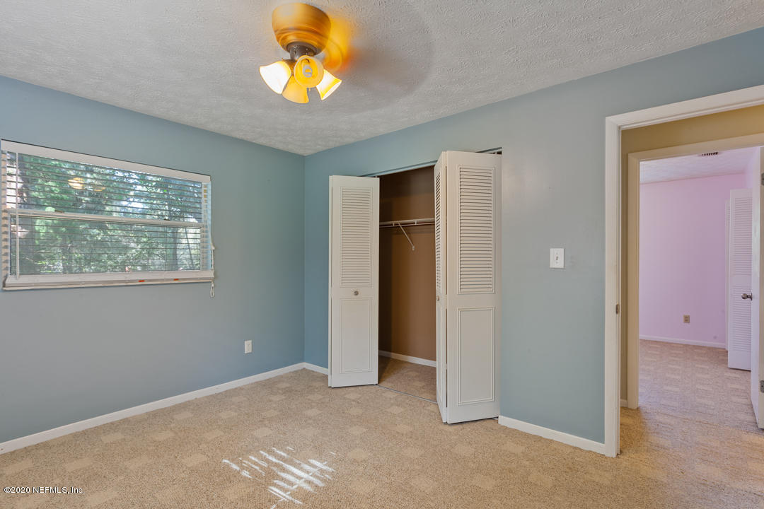 6576 Immokalee Road Keystone Heights, FL 32656 - Photo 20 of 31 an empty room with windows and closet