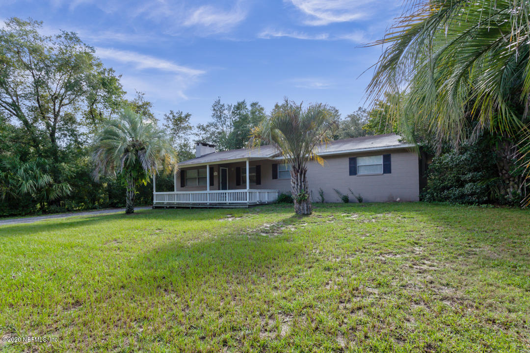 6576 Immokalee Road Keystone Heights, FL 32656 - Photo 30 of 31 a front view of a house with a garden